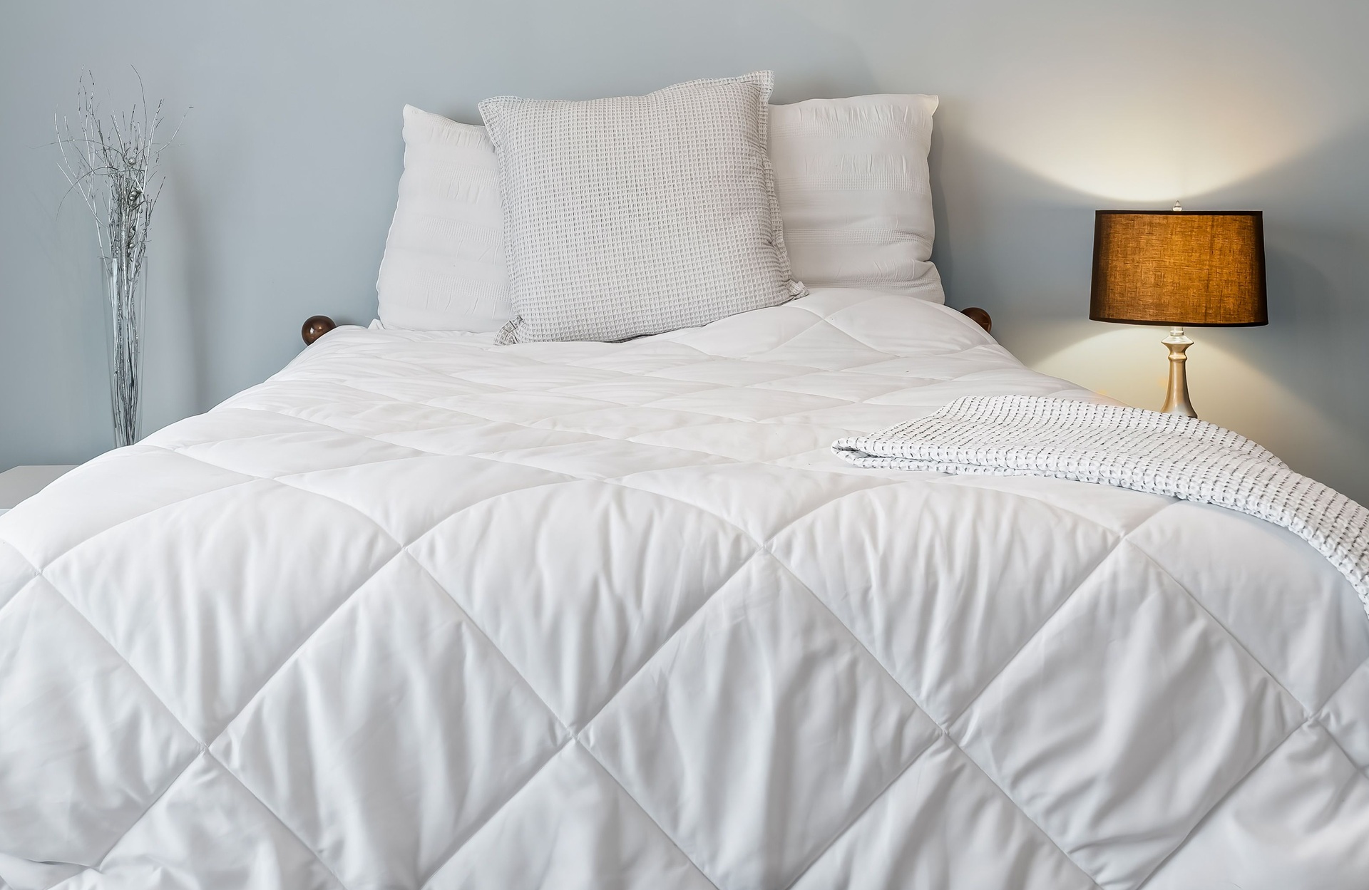 Interior shot of a modern bedroom in pastel colors.